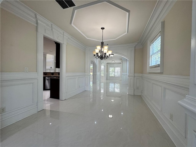 1417 Wind Chime Ct, Lawrenceville, GA 30045 - unfurnished dining area with a decorative wall, arched walkways, a chandelier, decorative columns, and light marble finish flooring