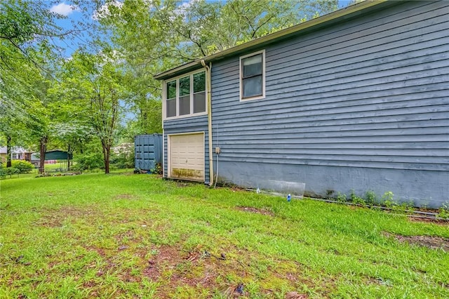 2419 Anderson Mill Rd, Austell, GA 30106 - view of side of property with an attached garage, driveway, and a lawn
