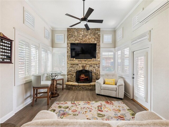 5964 Chickasaw Ln, Braselton, GA 30517 - living area with crown molding, a ceiling fan, a fireplace, a wall unit AC, and wood finished floors