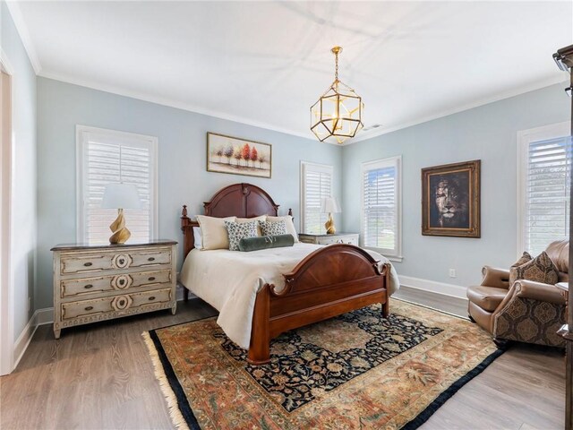 5964 Chickasaw Ln, Braselton, GA 30517 - bedroom with baseboards, wood finished floors, multiple windows, and crown molding