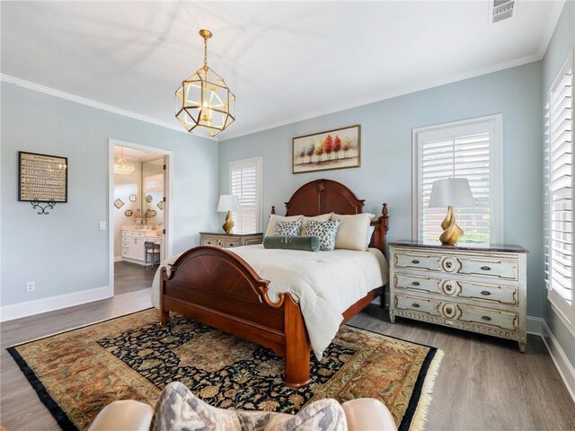 5964 Chickasaw Ln, Braselton, GA 30517 - bedroom with wood finished floors, ornamental molding, a chandelier, and visible vents