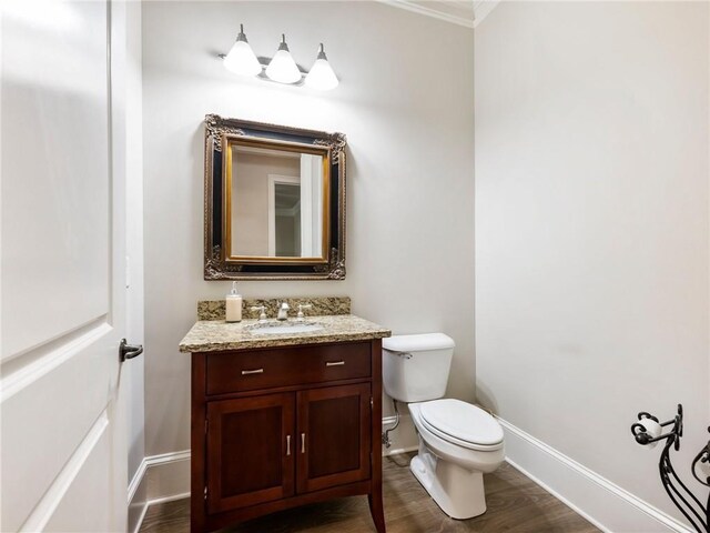 5964 Chickasaw Ln, Braselton, GA 30517 - bathroom with toilet, vanity, baseboards, and wood finished floors