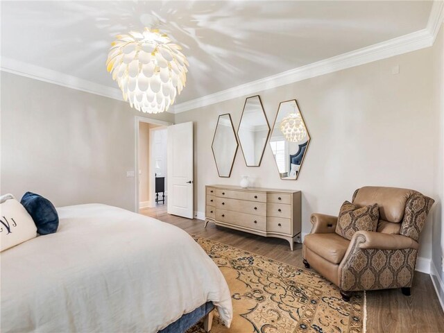 5964 Chickasaw Ln, Braselton, GA 30517 - bedroom featuring ornamental molding, wood finished floors, and a notable chandelier