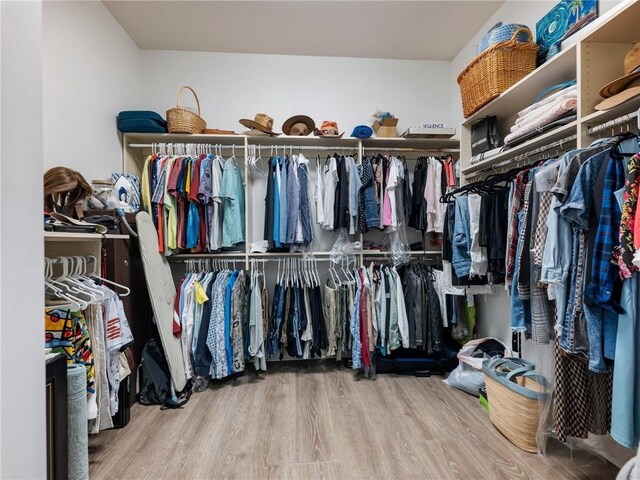 5964 Chickasaw Ln, Braselton, GA 30517 - walk in closet with wood finished floors