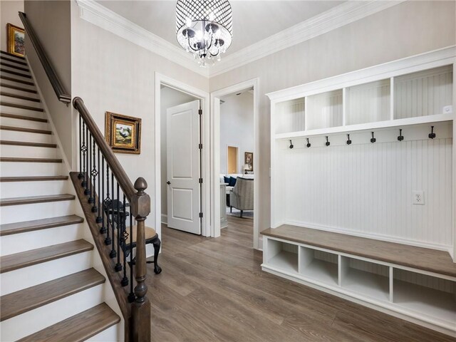 5964 Chickasaw Ln, Braselton, GA 30517 - mudroom with ornamental molding, wood finished floors, and a chandelier