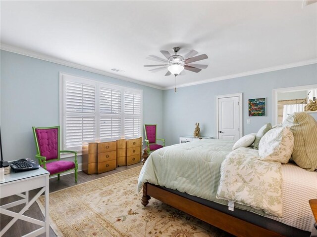 5964 Chickasaw Ln, Braselton, GA 30517 - bedroom with visible vents, crown molding, wood finished floors, and ceiling fan