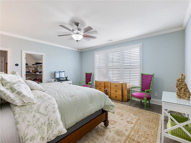 5964 Chickasaw Ln, Braselton, GA 30517 - bedroom featuring crown molding, a ceiling fan, wood finished floors, baseboards, and visible vents