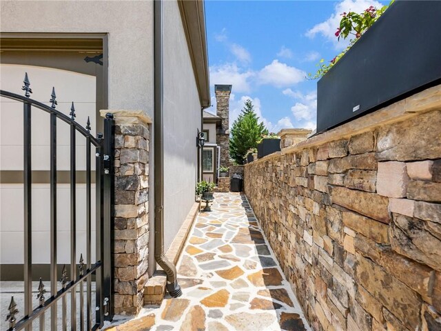 5964 Chickasaw Ln, Braselton, GA 30517 - view of side of home featuring stone siding