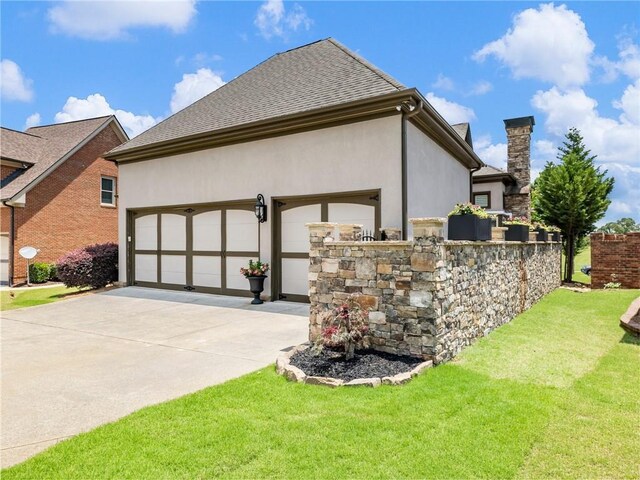 5964 Chickasaw Ln, Braselton, GA 30517 - view of side of property with driveway, an attached garage, a chimney, and stucco siding