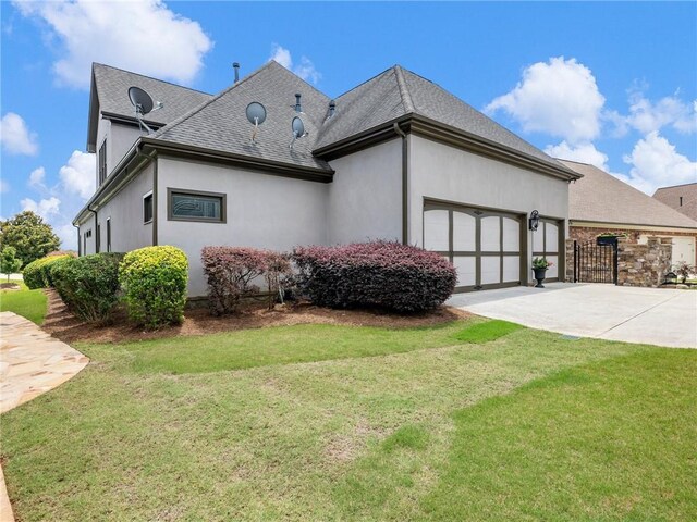 5964 Chickasaw Ln, Braselton, GA 30517 - view of property exterior featuring stucco siding, an attached garage, concrete driveway, and a yard