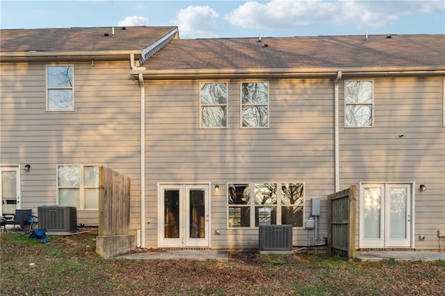 rear view of property with central AC and french doors