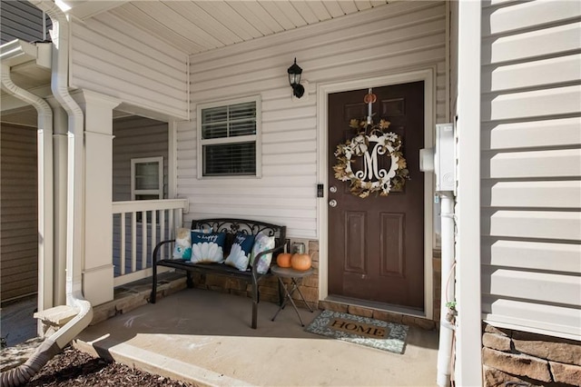 entrance to property featuring a porch