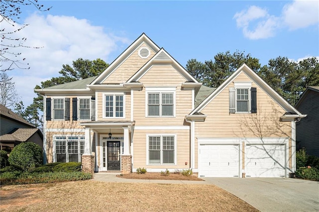 craftsman-style house with a garage and driveway