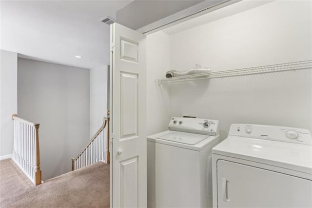 laundry room featuring laundry area, washer and dryer, carpet, and visible vents