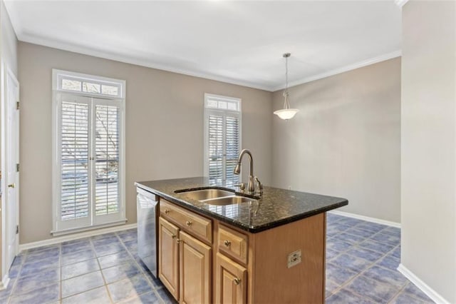 kitchen featuring a sink, dark stone counters, plenty of natural light, and dishwasher