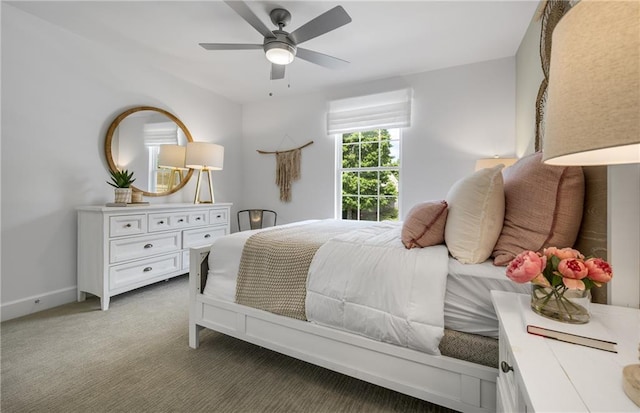 bedroom featuring ceiling fan and light carpet