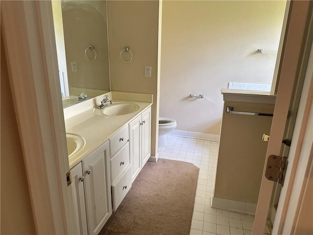 1570 Twin Bridge Ln, Lawrenceville, GA 30043 - full bathroom featuring tile patterned floors, toilet, double vanity, and baseboards
