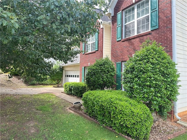 1570 Twin Bridge Ln, Lawrenceville, GA 30043 - view of home's exterior with a garage and brick siding
