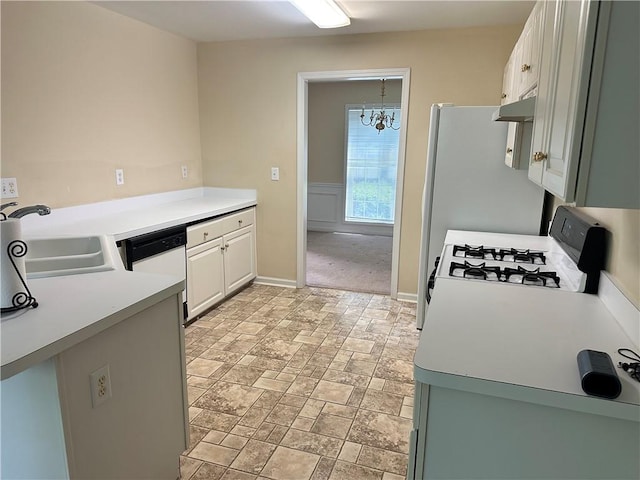 1570 Twin Bridge Ln, Lawrenceville, GA 30043 - kitchen with a sink, a chandelier, white appliances, under cabinet range hood, and white cabinets