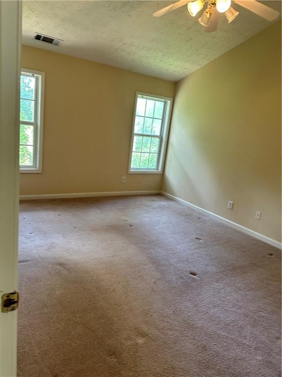 1570 Twin Bridge Ln, Lawrenceville, GA 30043 - carpeted spare room with ceiling fan, a textured ceiling, and baseboards