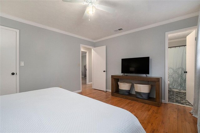 bedroom with ceiling fan, ornamental molding, and light hardwood / wood-style flooring