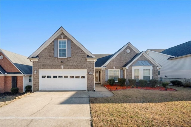 traditional-style house with concrete driveway, brick siding, and a front yard