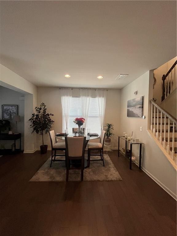 7699 Cabrini Pl, Fairburn, GA 30213 - dining space featuring stairway, dark wood-style flooring, recessed lighting, and baseboards