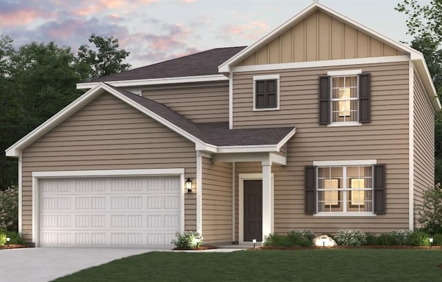 view of front facade with a garage, driveway, a yard, roof with shingles, and board and batten siding