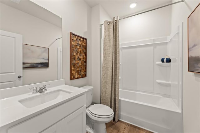 kitchen with white cabinets, an island with sink, appliances with stainless steel finishes, light countertops, and light wood-style floors