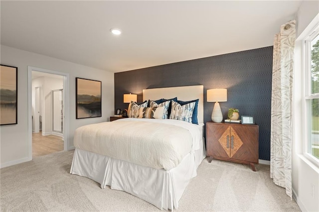 carpeted empty room featuring baseboards and recessed lighting