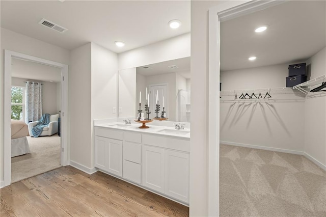 unfurnished bedroom featuring a closet, light colored carpet, and baseboards