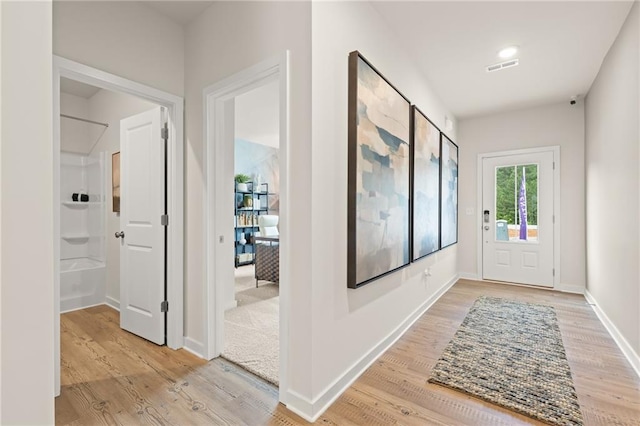 stairway with wood finished floors