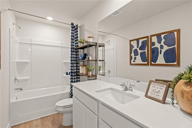 laundry area featuring baseboards, laundry area, wood finished floors, and hookup for an electric dryer