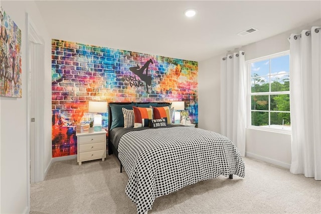 unfurnished bedroom with carpet flooring, baseboards, and ensuite bathroom
