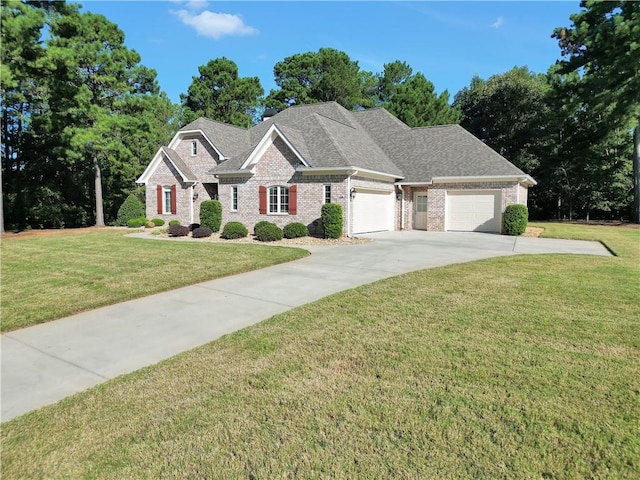 view of front of home featuring a garage and a front lawn