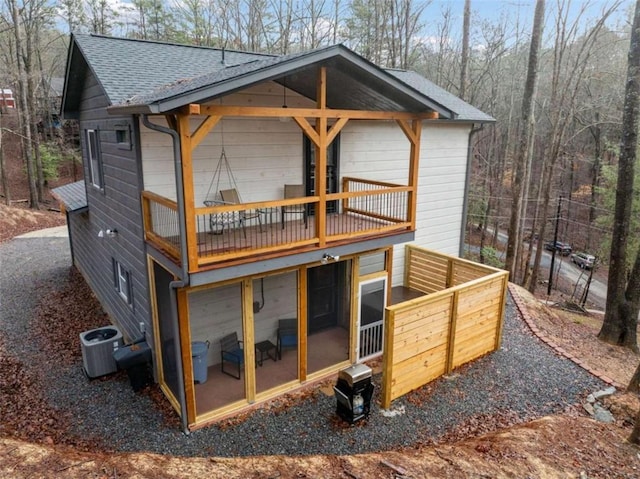 back of house featuring central AC unit