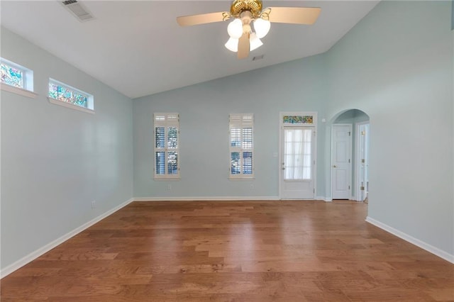 unfurnished room featuring wood-type flooring, lofted ceiling, and ceiling fan