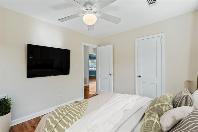 bedroom featuring hardwood / wood-style flooring and ceiling fan