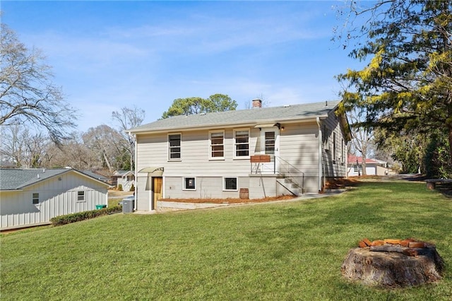 back of house featuring a yard