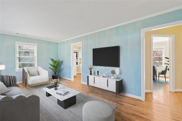 living room with hardwood / wood-style floors and ornamental molding