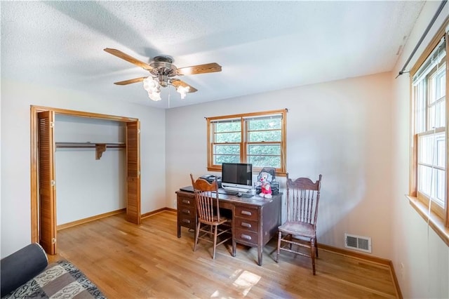 5670 Lanny Dr, Powder Springs, GA 30127 - office space featuring wood finished floors, ceiling fan, plenty of natural light, and a textured ceiling