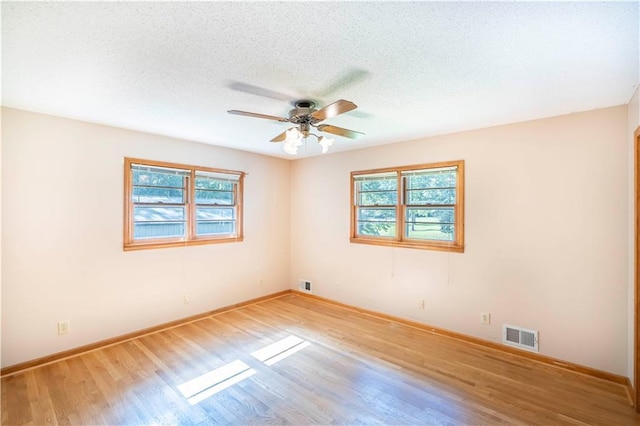 5670 Lanny Dr, Powder Springs, GA 30127 - unfurnished room with wood finished floors, ceiling fan, and a textured ceiling