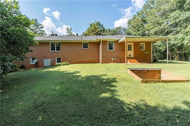 5670 Lanny Dr, Powder Springs, GA 30127 - rear view of property featuring a lawn and brick siding
