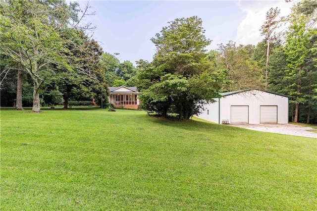 5670 Lanny Dr, Powder Springs, GA 30127 - view of green lawn featuring an outdoor structure and a garage