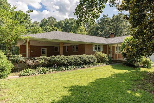 5670 Lanny Dr, Powder Springs, GA 30127 - view of front of house featuring a front yard, brick siding, and a chimney
