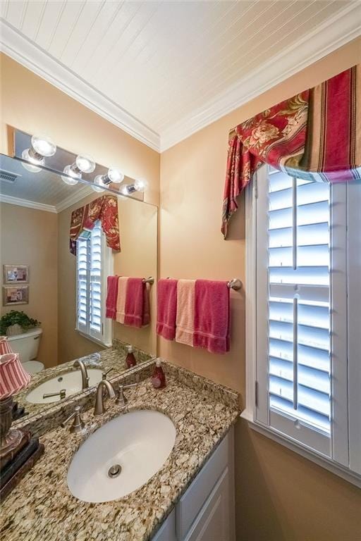 626 Dahoma Trl, Woodstock, GA 30188 - bathroom with vanity, crown molding, and toilet