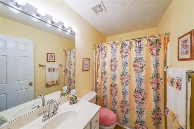 626 Dahoma Trl, Woodstock, GA 30188 - bathroom featuring toilet, vanity, a shower with shower curtain, and a textured ceiling