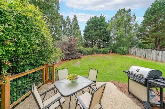 626 Dahoma Trl, Woodstock, GA 30188 - view of patio with a grill, outdoor dining space, and view of wooded area