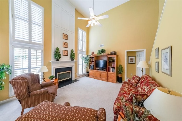 626 Dahoma Trl, Woodstock, GA 30188 - carpeted living room with high vaulted ceiling, plenty of natural light, a large fireplace, and a ceiling fan