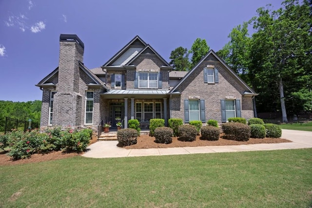 1231 Fawndale Dr NW, Kennesaw, GA 30152 - craftsman-style house with brick siding, a porch, a front lawn, and a chimney